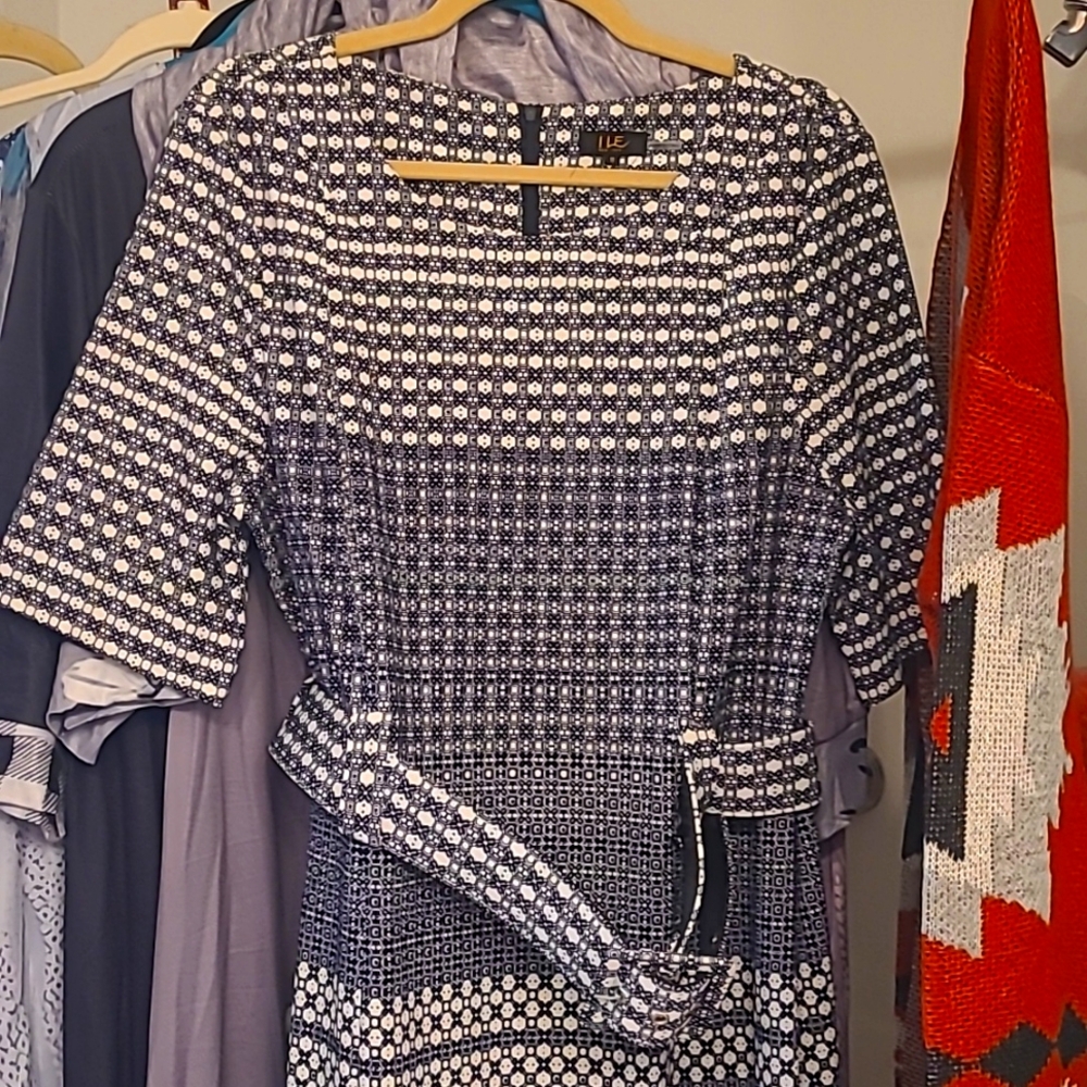 New dress size 18, elbow length sleeves, belt, knee length.